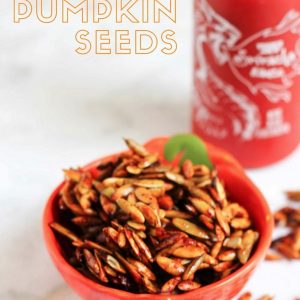 A super healthy snack recipe: honey sriracha pumpkin seeds! Spicy with a sweet kick. Check out the recipe on fitnessista.com