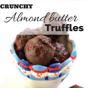 Crunchy almond butter truffles! Are you looking for a healthier but still delicious option for holiday cookies? These are a decadent holiday treat without added refined sugars. Crunchy almond butter truffles are coated with rich chocolate, and have an awesome crunch from puffed rice cereal. You need these in your life.